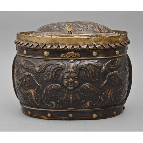 584 - A French cuir bouilli box, 18th c, of oval shape with scalloped and rivetted brass mounts and leathe... 