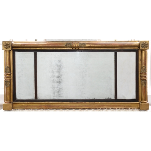 803 - An early Victorian brass mounted giltwood over-mantel mirror, applied with anthemia and rosettes, 61... 