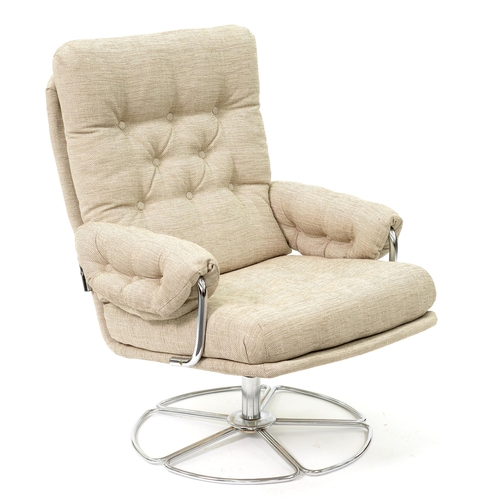 914 - A chromium plated tubular steel and upholstered swivel armchair