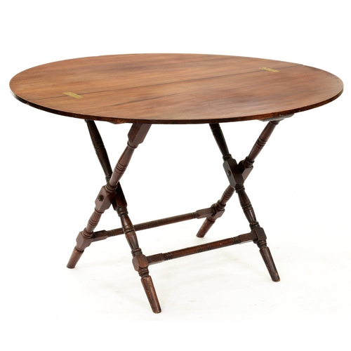 922 - A mahogany folding table, Thornton & Heath 13 Little Goodman Place Pont Street SW, c1920, on tur... 