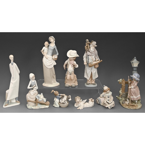 120 - Eight Lladro figures and a Nao figure, late 20th century, 36cm h and smaller, printed mark... 