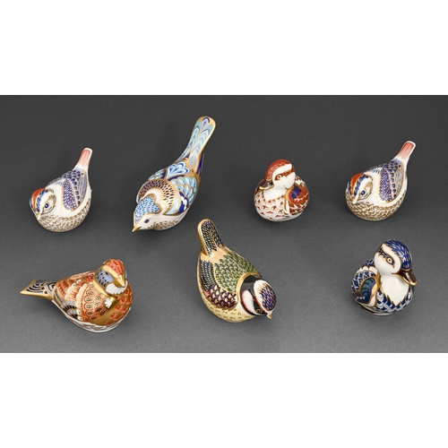 129 - Seven Royal Crown Derby bird paperweights, various sizes, printed mark, gilt stopper (7)... 