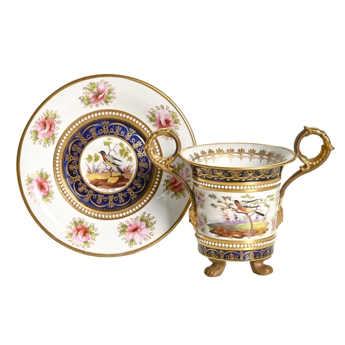 284 - A Charles Bourne two-handled cabinet cup and stand, c.1820-1825, the cabinet cup on three paw feet, ... 