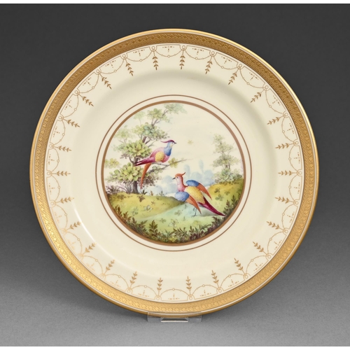 4 - A Cauldon plate enamelled, c1920, with two birds, the rim gilt and etched, 22cm diam, printed puce m... 