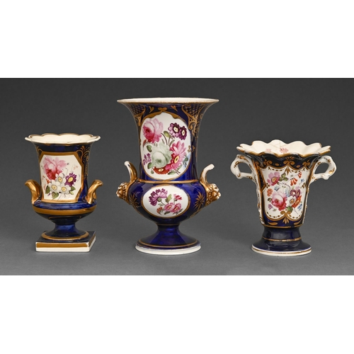 47 - Two Staffordshire porcelain campana vases and another, 1820s, one with with lion mask handles and an... 