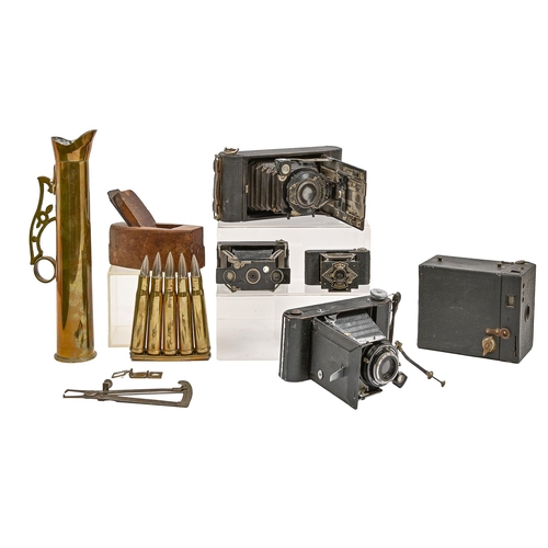 534 - Miscellaneous bygones including vintage cameras, a wood plane, trench art and brass bullet casings, ... 