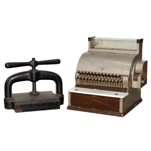 536 - A Stevenson's National mechanical cash register, mid-20th c, and a cast iron book press, early 20th ... 