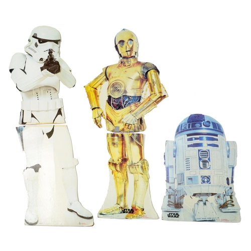 537 - Star Wars. Three cardboard cutout characters, C-3PO, 168cm h, R2-D2, 96cm h and Imperial Storm Troop... 