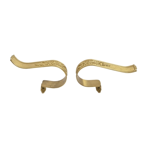 573 - A pair of gilt lacquered brass curtain tie backs, in Empire style, and wall mounts (4)... 