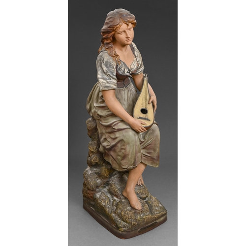 77 - A French terracotta figure of a seated girl, c.1900, 'Mignon' designed by J. Le Guluche, c.1900, 58c... 