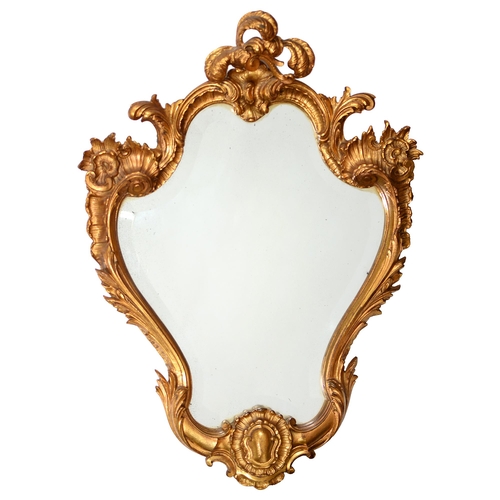 800 - A gilt lacquered brass rococo revival mirror late 19c, with bevelled plate, 73 x 53cm... 