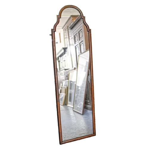 802 - A walnut framed arch-top mirror, 153 x 45cm