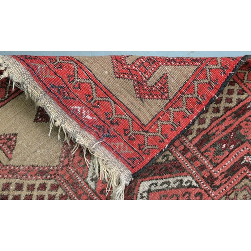 828 - A Kurdish rug, 206cm x 122cm, an Afghan rug, 144cm x 100cm and an Afghan prayer rug, 115cm x 76cm (3... 