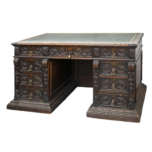 832 - A carved oak pedestal desk, late 19th c, with panelled front and sides, fitted nine drawers, 75cm h;... 