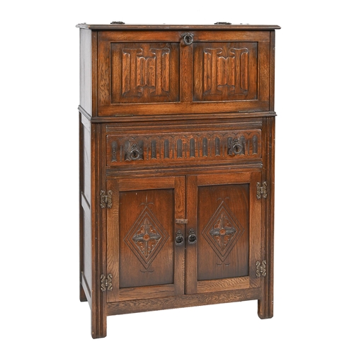 843 - An oak cocktail cabinet, 121cm h; 42 x 75cm