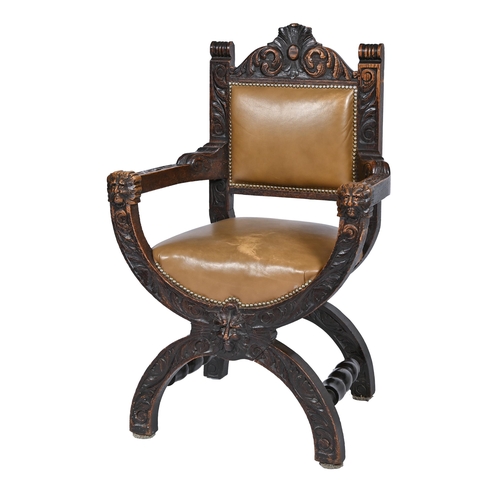 857 - A Northern European carved and stained oak armchair, late 19th c, with brass nailed and padded leath... 