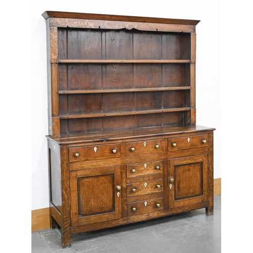 858 - A George III oak dresser, North Wales, early 19th c, with scratch moulded drawers, blind drawers and... 