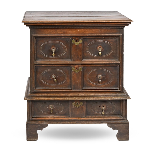 868 - An Anglo-Dutch oak chest-on-stand, early 18th c, with stepped top and dentil cornice, above geometri... 