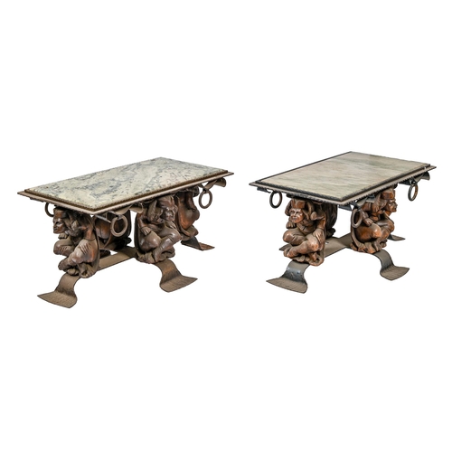 878 - A pair of carved wood and wrought iron tables, with chamfered marble slab supported on four crouchin... 