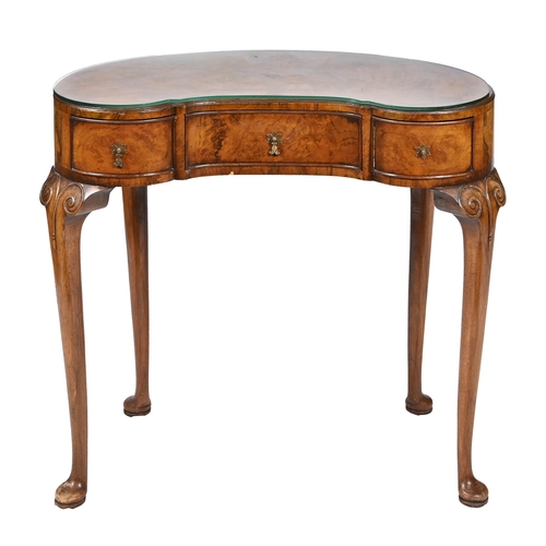 890 - A kidney shaped walnut and burr walnut dressing table, c1930, with crossbanded top, oak lined drawer... 