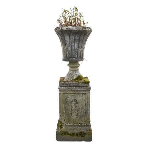 905A - Garden ornaments. A reconstituted stone vase and pedestal, 128cm h