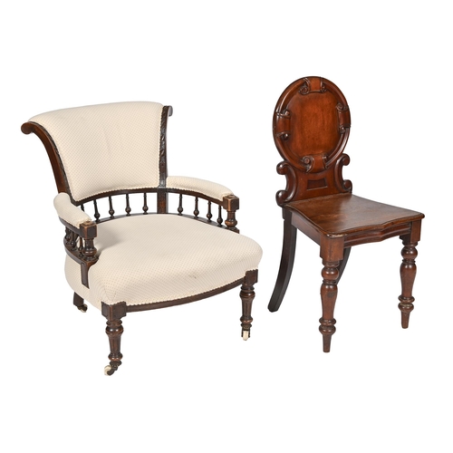 909 - A Victorian mahogany hall chair and a Victorian carved and stained walnut armchair