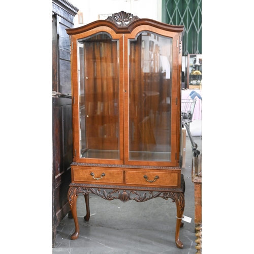 932 - A walnut china cabinet, with bevelled glass to the sides and pair of doors, 174cm h; 42 x 89cm... 