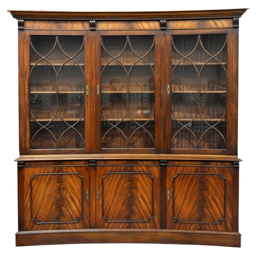 939 - A mahogany concave bookcase, late 20th c in George III style and a similar break front side cabinet,... 