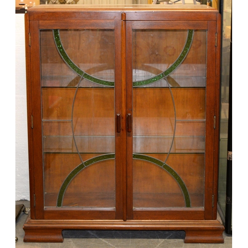 964 - A walnut china cabinet with leaded glass doors, c1940, 124cm h; 33 x 94cm