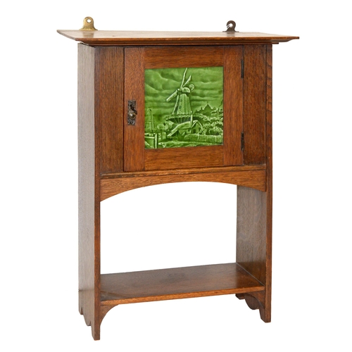 971 - An oak wall hanging cupboard, early 20th c, the door enclosed with green glazed earthenware tile, 54... 