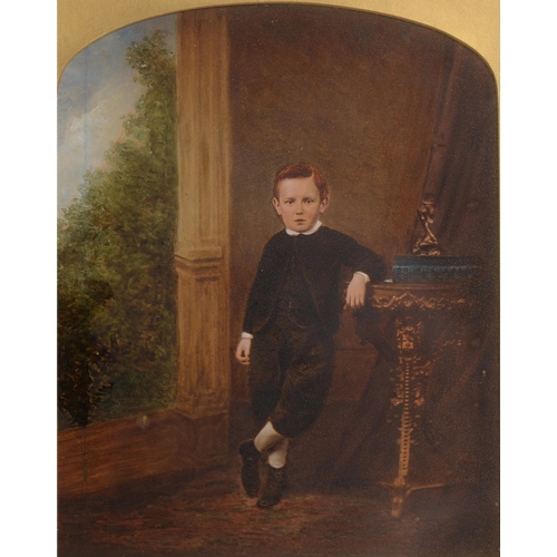 743 - British photographer unknown, c1880 - A Boy by a Window, overpainted albumen print, arched top, 25cm... 