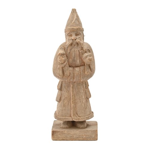 743 - A Northern European wood sculpture of Father Christmas, early 20th c, 35cm h