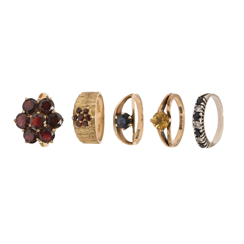 15 - Four garnet, citrine and other rings, in 9ct gold, 13.8g, various sizes and another ring (5)... 