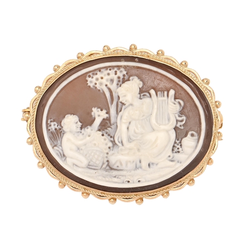 180 - A cameo brooch, the oval shell carved with classical figures, in 9ct gold mount, 39mm l, Birmingham ... 