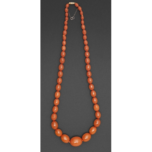 195 - A necklace of pressed amber beads, 64g