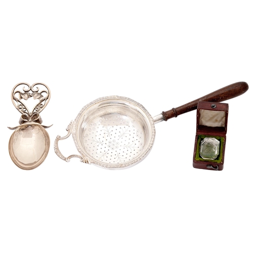 257 - A silver caddy spoon with wirework handle, 90mm l, unmarked, a silver tea strainer, wood handle, Bir... 