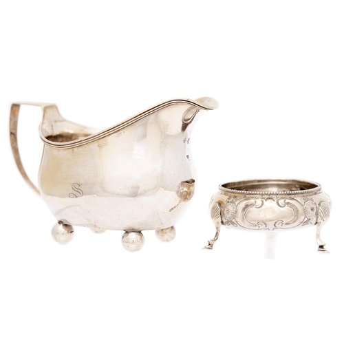 263 - A George III silver cream jug, 13.5cm l, maker J H, part marked and a Victorian silver salt cellar, ... 