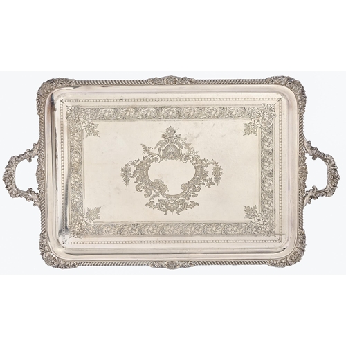 318 - An Edwardian EPNS tea tray, with gadrooned rim and engraved field, 71.5cm over handles... 