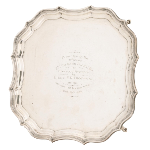 321 - A George V silver salver, shaped square with moulded border, the field engraved with presentation in... 