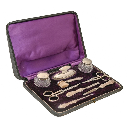 346 - A George V silver manicure set, by H Matthews, Birmingham 1915, cased