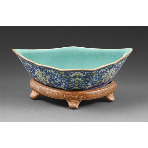 372 - A Chinese blue ground porcelain segmental dish, 19th c, with stand, 21.5cm diam