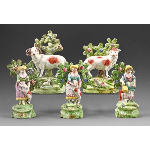 386 - Five Staffordshire earthenware figures and models of sheep, c.1820, two shepherdesses, a gardener an... 