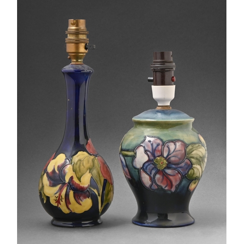 404 - Two Moorcroft Clematis and Hibiscus lamps, c1960-70, 15.5cm and 22cm h excluding fitment, impressed ... 