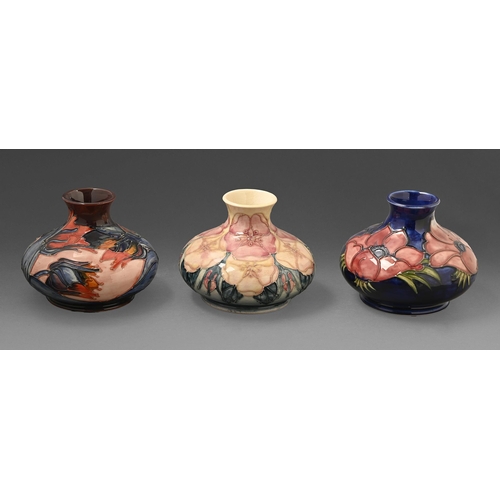 409 - Three Moorcroft Tudor Rose, Red Tulip and Anemone vases, 1980s-1992, 10cm h, impressed marks and pai... 