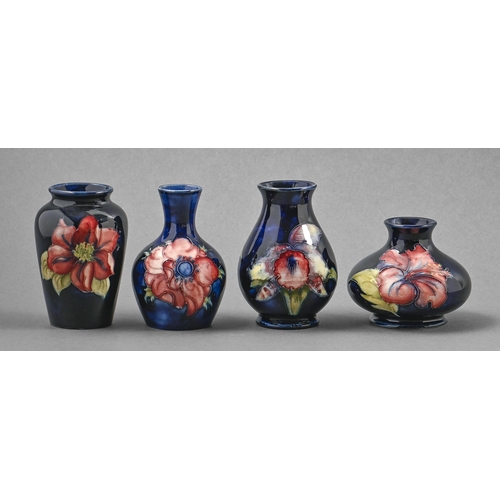 410 - Four Moorcroft Anemone, Clematis, Hibiscus and Orchid vases, c1970, 70mm-96mm h, impressed marks... 