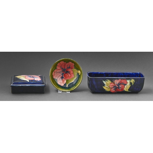 411 - A Moorcroft Hibiscus flower trough, box and cover and bowl, c1970, flower trough 20cm l, impressed m... 