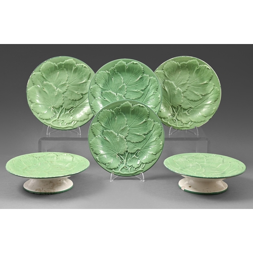 422 - A Thomas Dimmock green glazed and moulded earthenware dessert service, c1870, with green enamel rim,... 