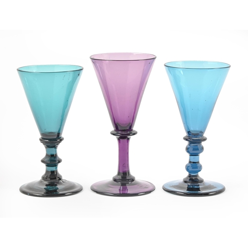 453 - One and a pair of early Victorian amethyst and kingfisher blue wine glasses, 12.5 and 14cm h, collec... 