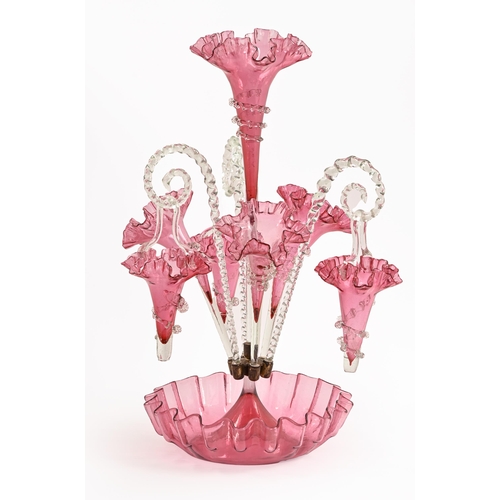 475 - A Victorian cranberry glass flower stand, of four vases and three hanging vases with trailed decorat... 