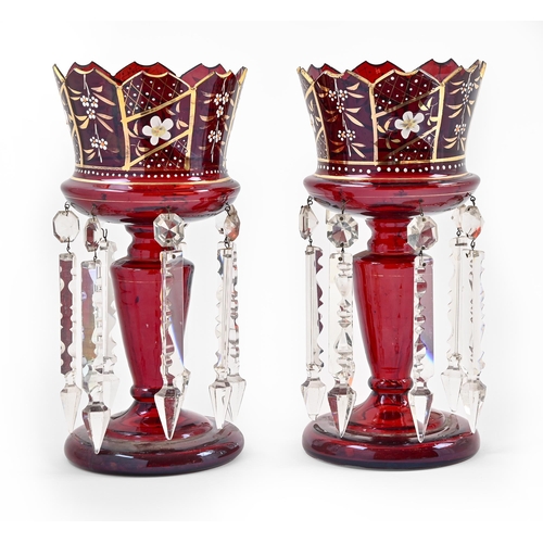 498 - A pair of ruby glass lustres, late 19th c, with gilt rim and enamelled flowers and prismatic cut gla... 